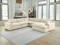 Beige Elyza 5-Piece Sectional in a modern living room with large windows.