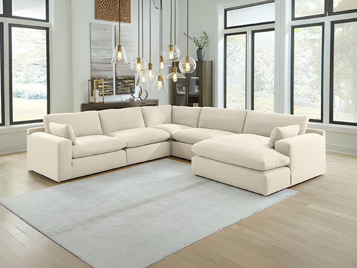 Beige Elyza 5-Piece Sectional in a modern living room with large windows.