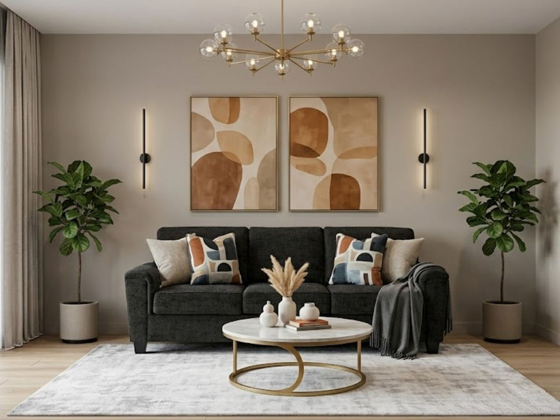 Dark gray sofa in a modern living room with abstract wall art, a round coffee table, and indoor plants.