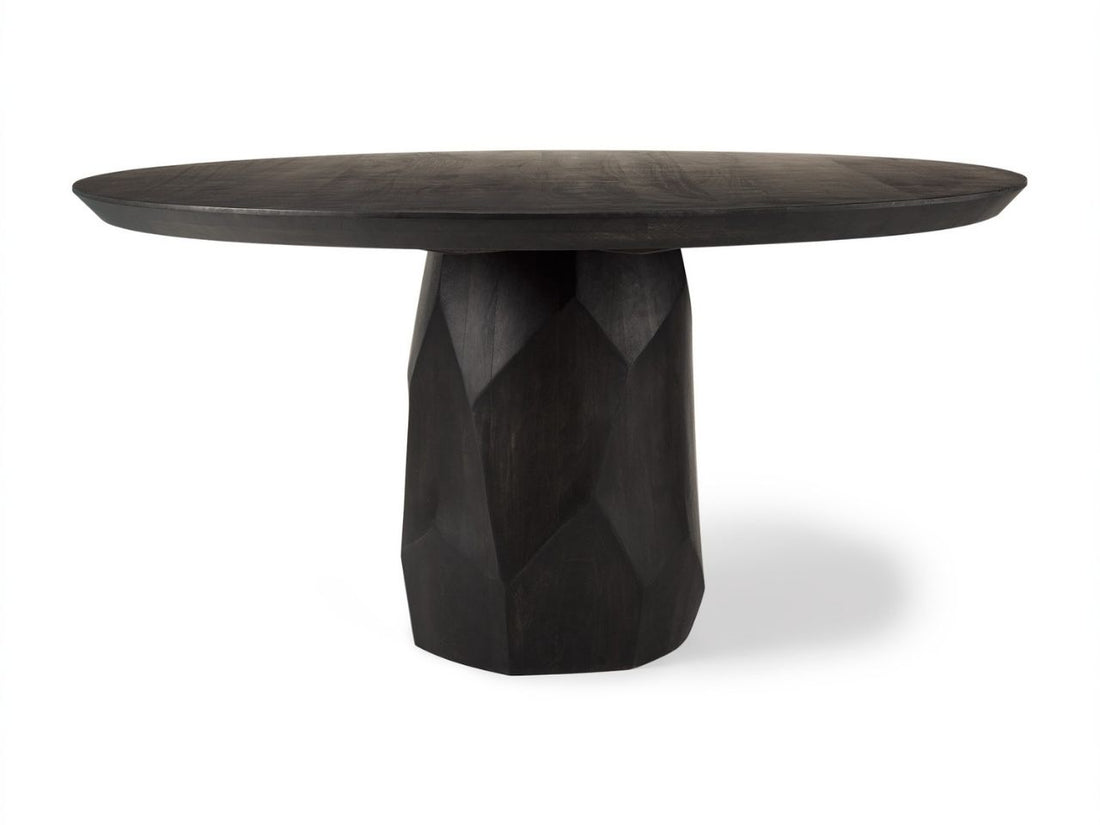 Dark wooden table with a unique base design on a white background