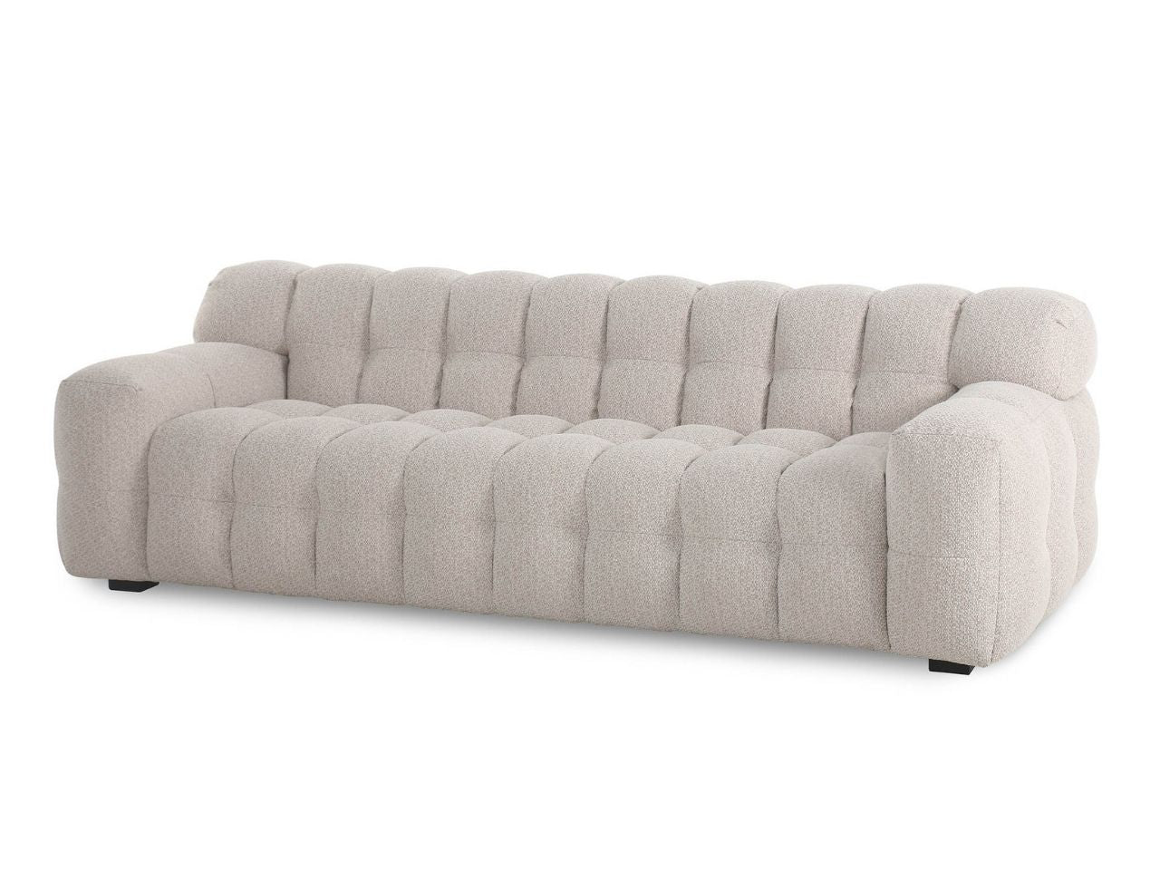 Three-seat sofa with plush channel-tufted cushions, upholstered in soft fabric, shown on a white background.