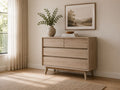 Light wood dresser with clean modern lines and spacious storage drawers.
