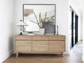 The Gia Sideboard is a contemporary storage piece made from light-finished wood with a visible grain.