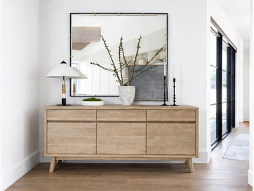 The Gia Sideboard is a contemporary storage piece made from light-finished wood with a visible grain.
