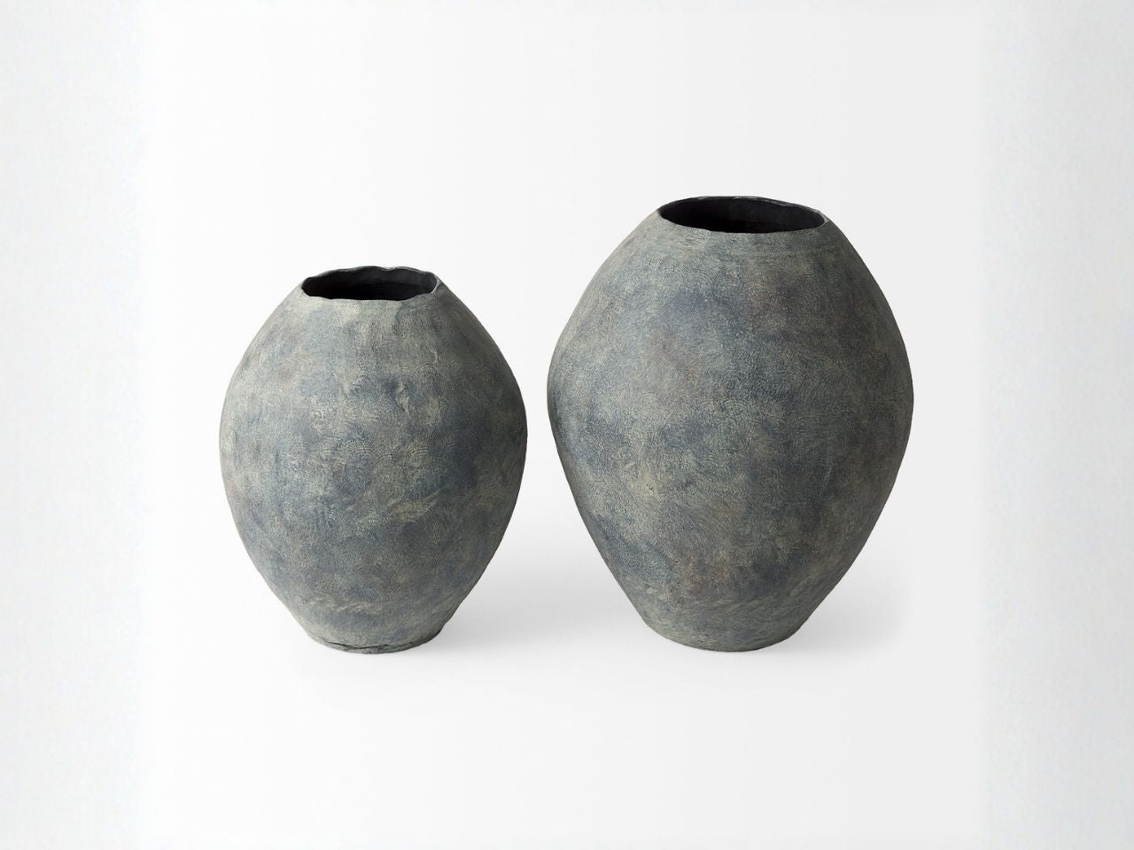 Two gray ceramic vases on a white background in Calgary