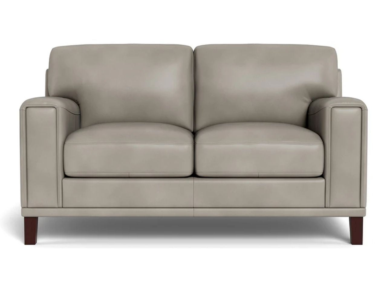 A contemporary leather loveseat with a boxy profile, wide arms, and smooth cushions, shown in light grey leather against a white background.