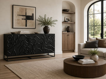Modern black sideboard featuring artistic carved doors and a bold statement design.