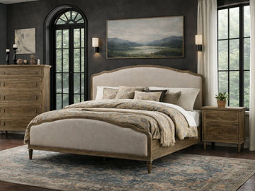 Beige upholstered Interlude bed in Calgary with pillows in a bedroom setting.