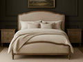 Beige upholstered Interlude bed in Calgary with matching headboard in a bedroom setting.