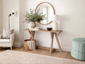A rustic, light-wood console table with a rectangular top and architectural angled legs.
