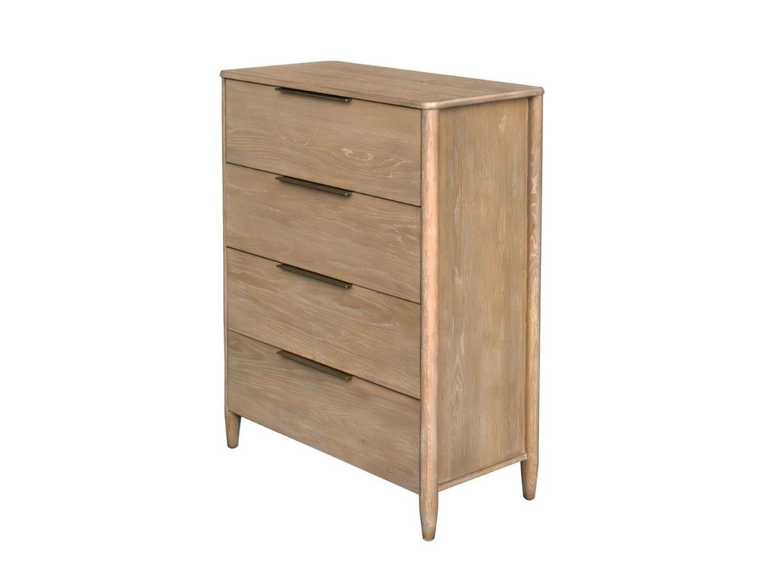 Light wood four-drawer chest styled in a bright bedroom with mirror and lamp.