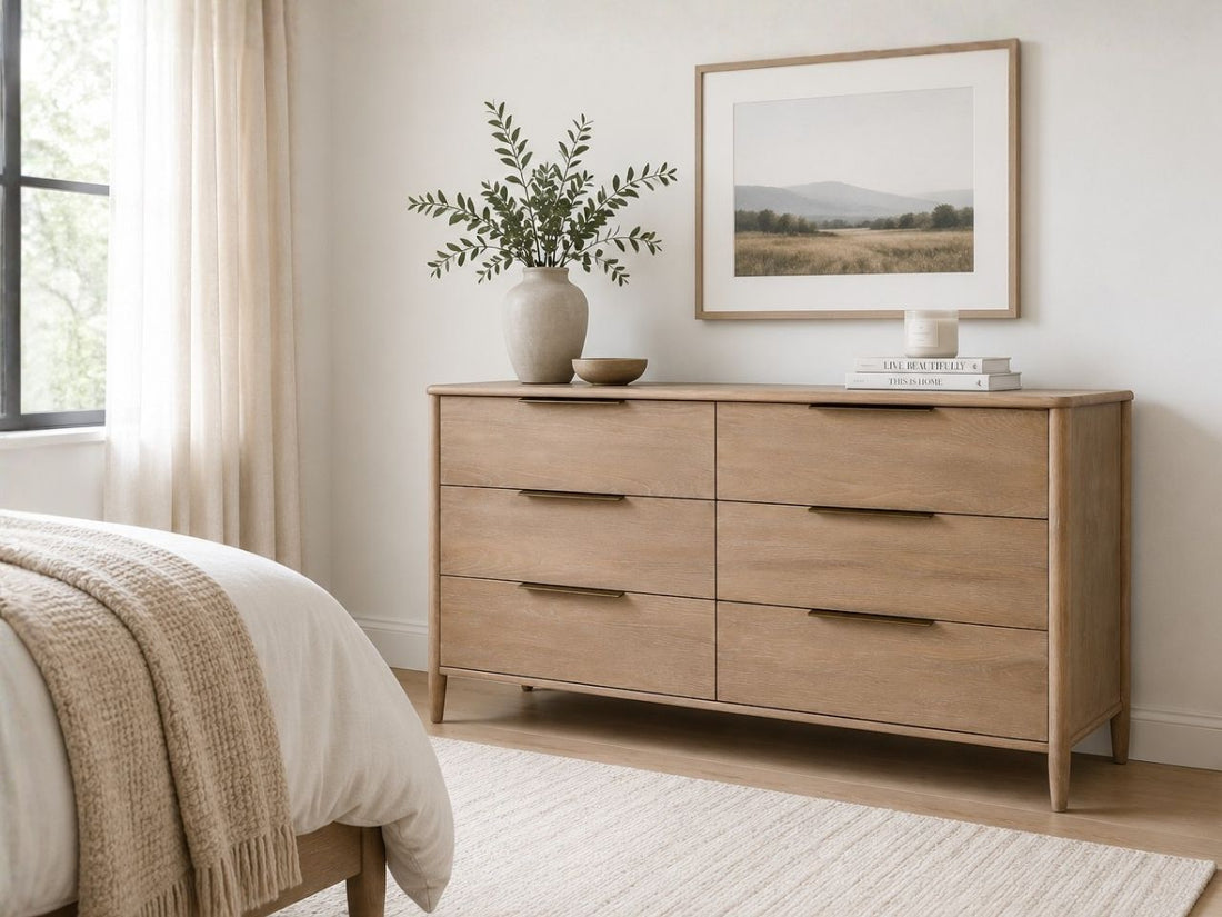 Light wood six-drawer dresser with slim metal pulls and a clean modern style.