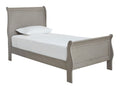 Gray-washed sleigh bed with classic panel detailing and a timeless cottage-inspired design.