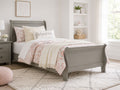 Gray-washed sleigh bed with classic panel details and a charming cottage-style design.