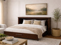 Dark wood cabinet bed opened to reveal a queen-size bed, styled in a bright, neutral living space.