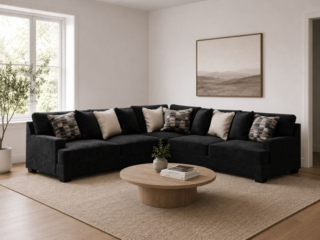 Charcoal sectional sofa with accent pillows in a modern living room.