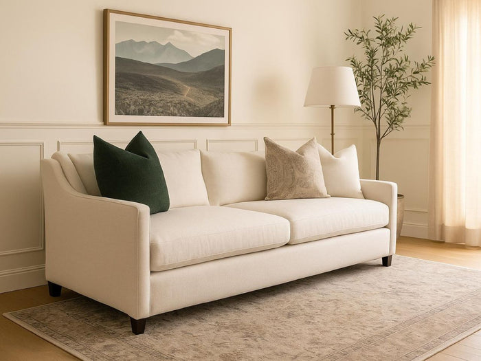 Lease sofa in Calgary with decorative pillows in a living room setting.
