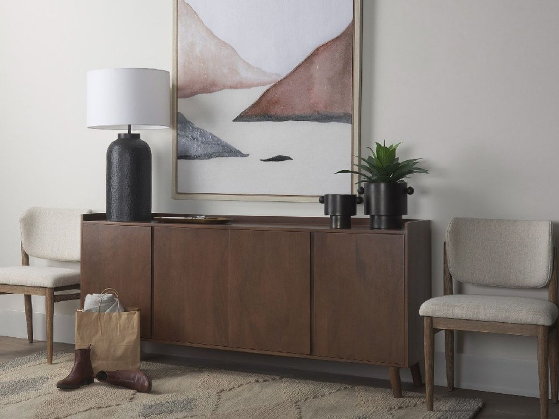 A dark brown, clean-lined sideboard with four flush doors and a slight gallery edge on top. 