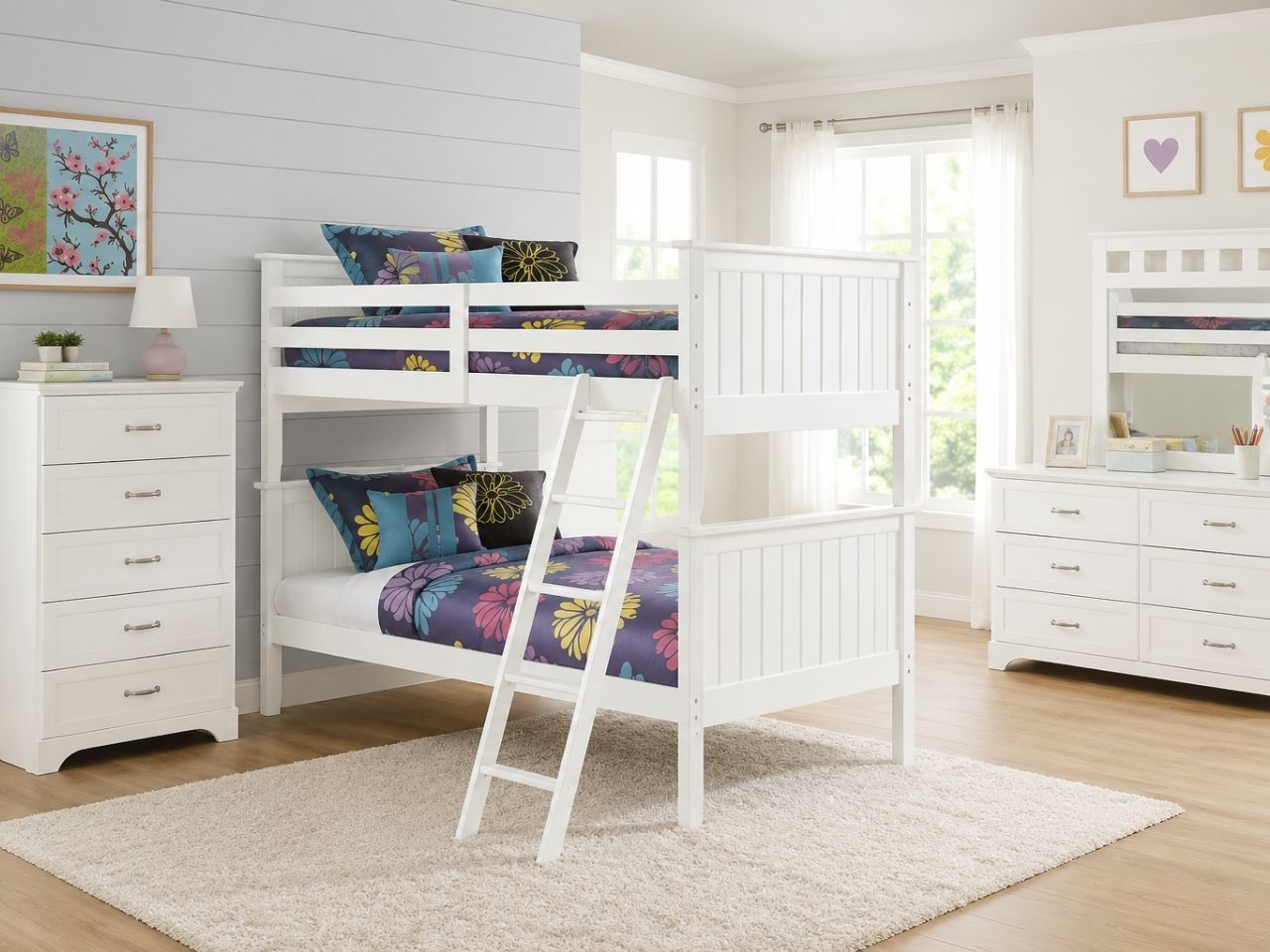 White bunk bed with ladder and colorful floral bedding in a bright kids' bedroom.