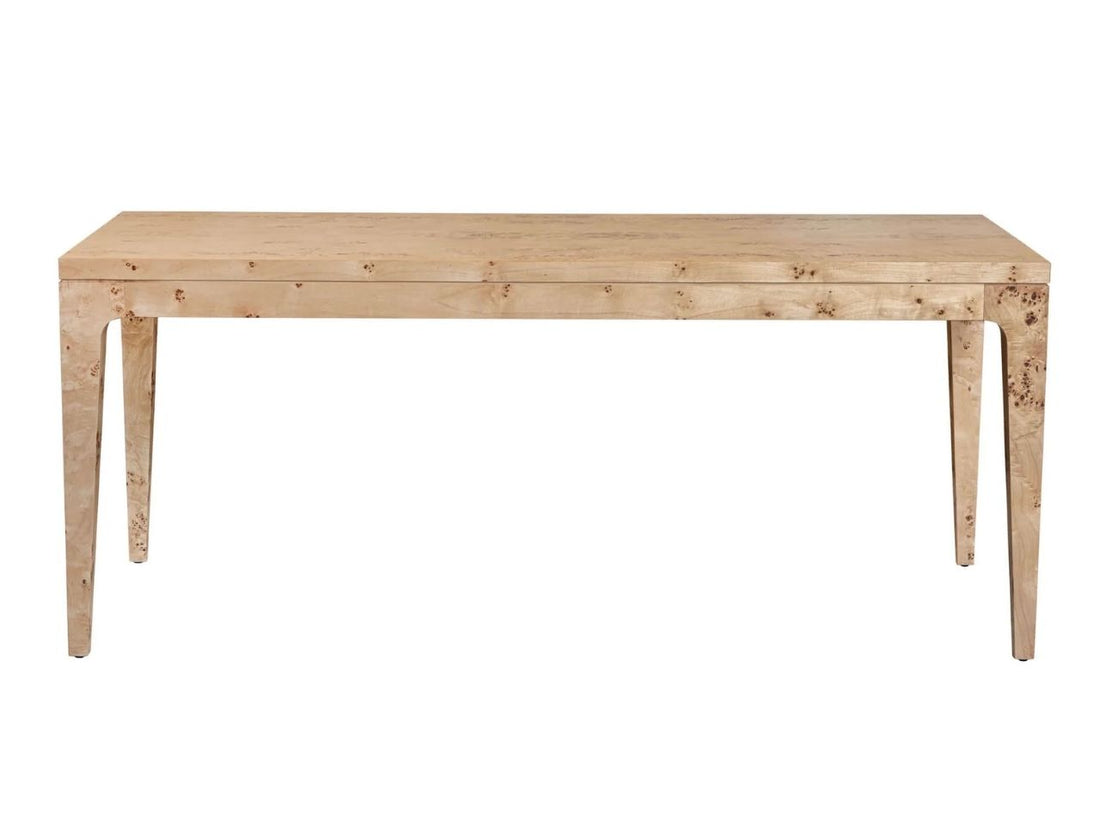 Rectangular burl wood dining table styled with chairs in a bright dining room.
