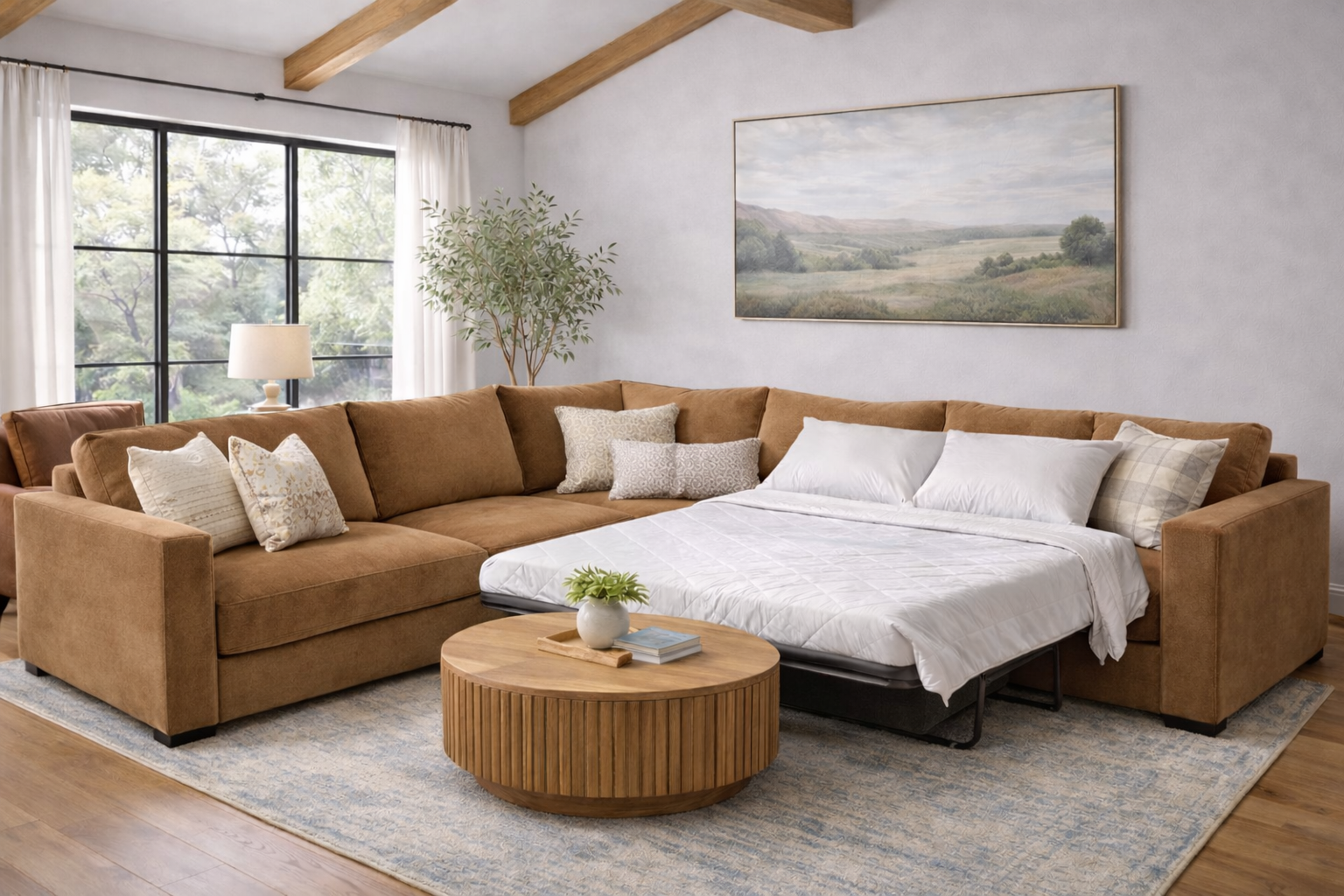 A warm camel-colored fabric sectional in an L-shape configuration with the sleeper bed pulled out and ready for guests.