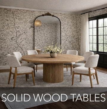 Dining room with a round wooden table and chairs, featuring a decorative wall and pendant lights by Showhome Furniture.