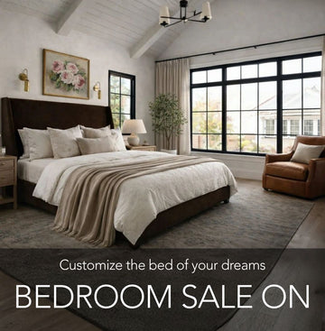 Modern bedroom with large windows, bed, and armchair, featuring a bedroom sale promotion.