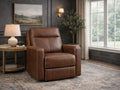Brown reclining armchair upholstered in smooth leather or leather-look fabric, styled in a cozy living room with dark walls.