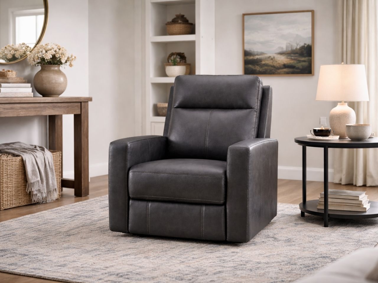 Dark gray reclining armchair upholstered in leather or leather-like material, set in a modern living room with neutral décor.