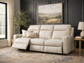 Cream leather reclining sofa with one seat extended, styled in a modern living room.