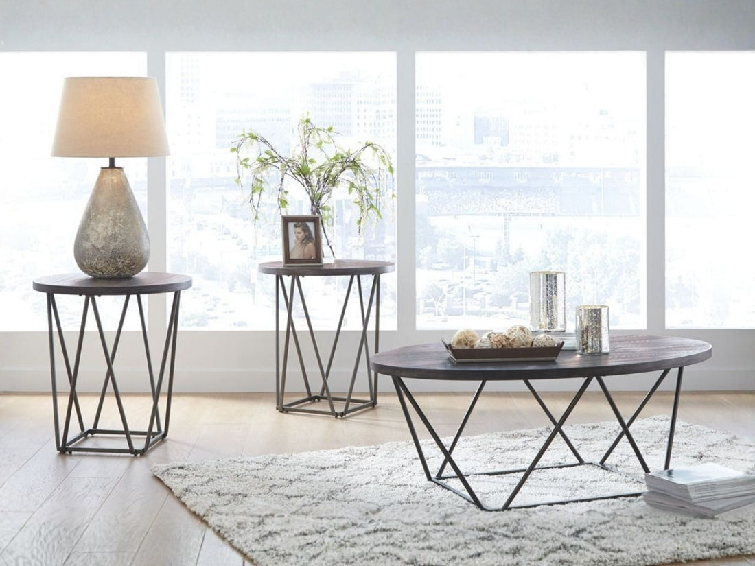 Oval wood coffee table with metal frame and two matching round side tables on a white background.