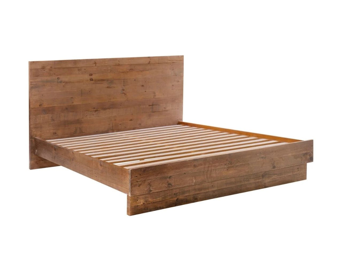 Rustic solid wood platform bed with plank headboard and neutral white bedding.