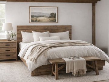 Rustic solid wood platform bed with plank headboard and neutral white bedding.