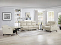 Cream leather reclining sofa and loveseat set in a bright living room.