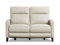 Cream leather power reclining loveseat with padded cushions in a white background. 