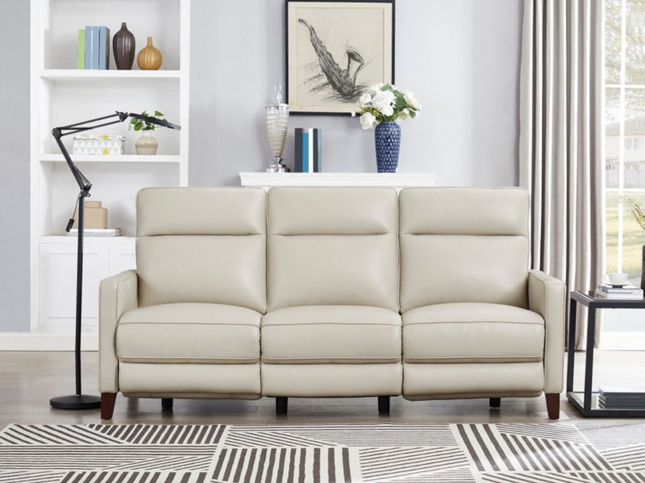 Cream leather recliner sofa in a bright living room