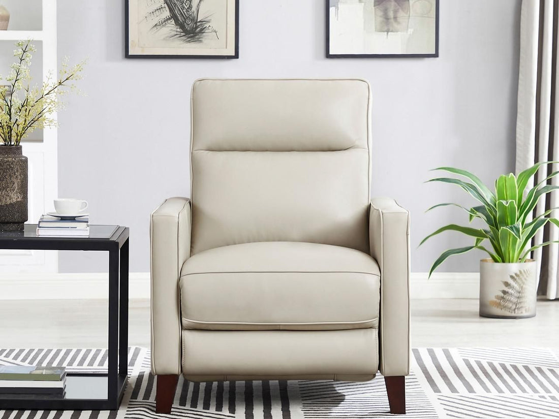 Light beige leather recliner chair in a modern living room.