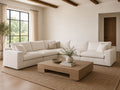 Large white sectional sofa in a bright modern living room.