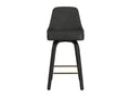 Black upholstered counter stool with curved back, dark wood legs, and brass footrest shown from the front on a white background.