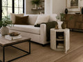 Light wood accent cabinet with a rounded fluted design and storage door, styled next to a cream sofa in a modern living room.