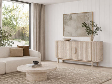 Elegant modern sideboard with a softly curved silhouette, fluted door fronts, and a light natural finish that creates a refined, organic aesthetic.
