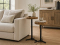 Set of two live-edge wood martini tables with black metal pedestal bases, styled beside a cream sofa in a modern neutral living room.