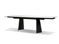 Modern black rectangular dining table with a stone top and sculptural metal legs on a white background.