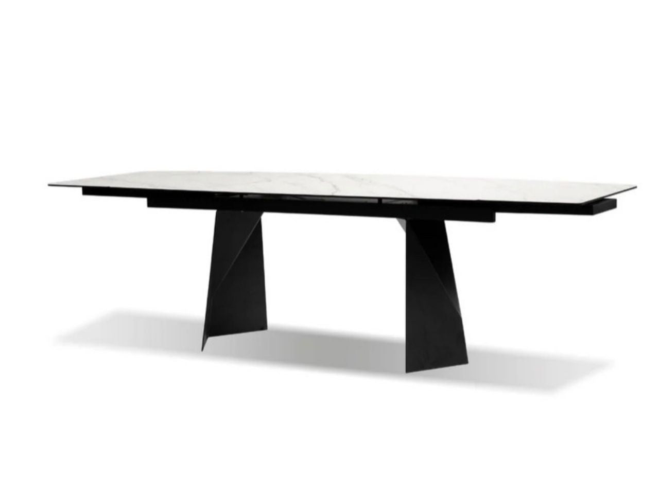 Modern black rectangular dining table with a stone top and sculptural metal legs on a white background.