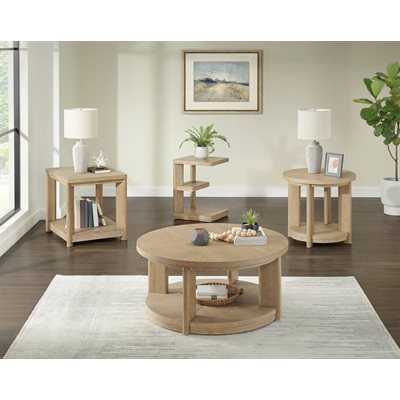 Light wood round coffee table with matching side tables styled in a bright, modern living room.