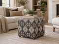 Charcoal and cream geometric patterned ottoman with a soft upholstered finish and small wooden legs.