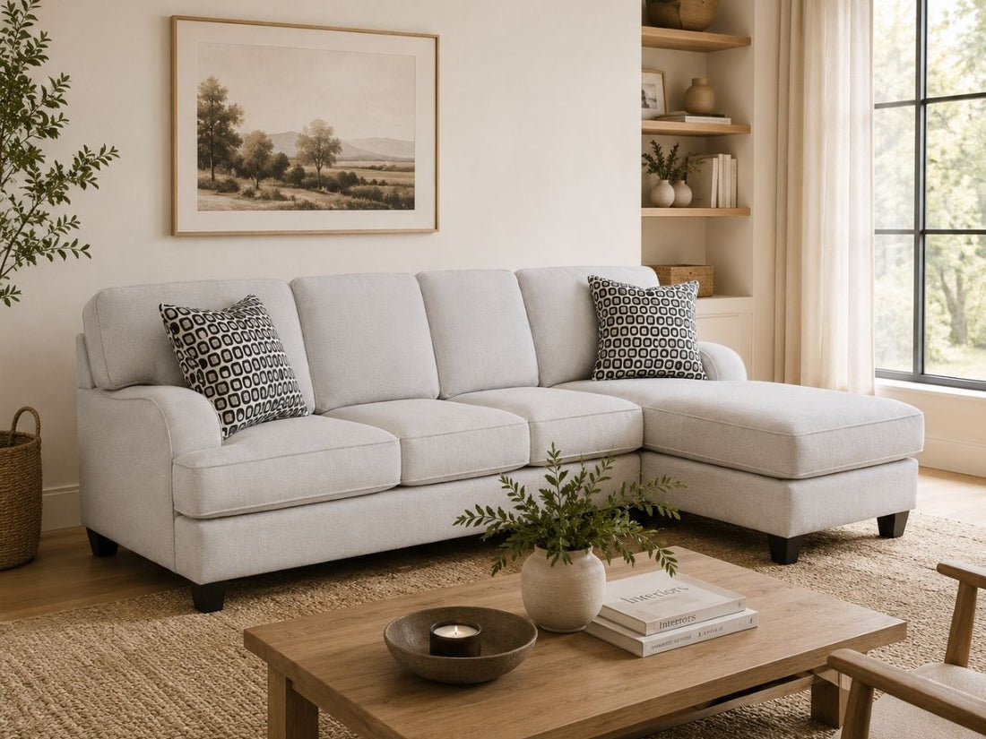 Light gray sofa chaise sectional in a warm modern living room.
