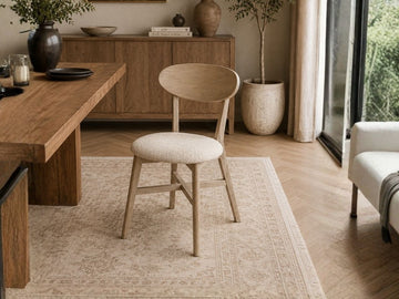 ROSE DINING CHAIR - SCRUBBED TEAK in a dining room setting. 