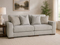 Light gray 2-piece loveseat sectional sofa with matching accent pillows in a cozy modern living room.