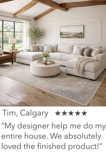 Modern living room with a sectional sofa, coffee table, and decor elements.